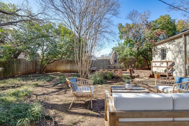 view of yard featuring a deck and a fenced backyard