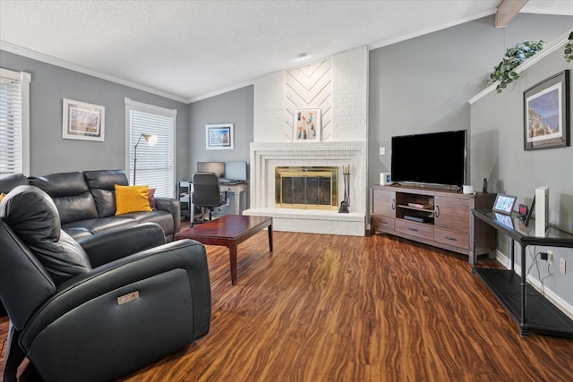 living room featuring lofted ceiling with beams, a textured ceiling, a fireplace, and wood finished floors