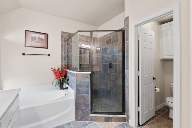 full bathroom featuring a stall shower, lofted ceiling, toilet, and a bath