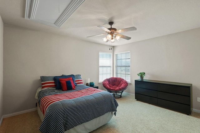 bedroom with attic access, carpet, baseboards, and a ceiling fan