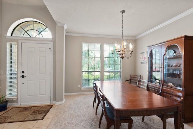 dining area with crown molding, light tile patterned floors, baseboards, and a notable chandelier