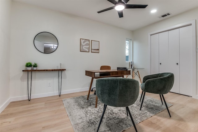 office space with recessed lighting, visible vents, light wood-style floors, ceiling fan, and baseboards