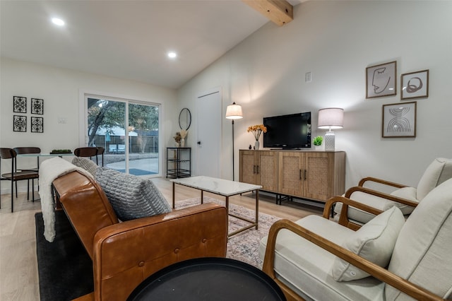 living area with lofted ceiling with beams, recessed lighting, and light wood-style floors