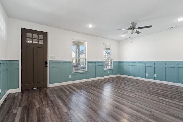 spare room featuring visible vents, recessed lighting, dark wood-type flooring, and ceiling fan