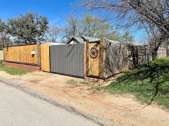 view of gate with fence