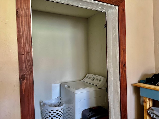 laundry room with laundry area and washer / clothes dryer