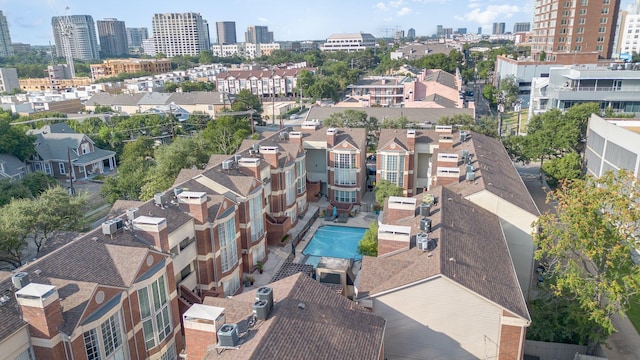 birds eye view of property with a city view