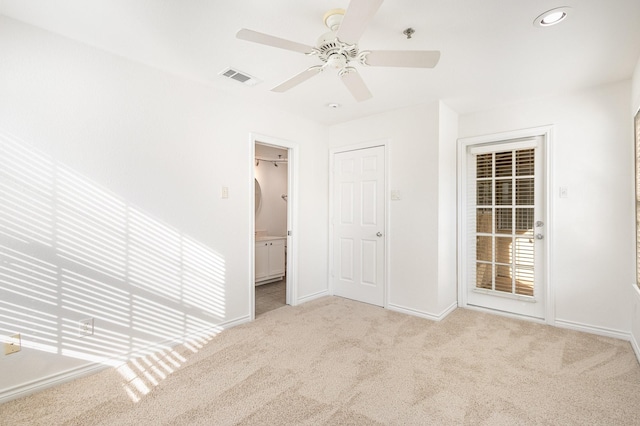 unfurnished room with baseboards, visible vents, light colored carpet, ceiling fan, and recessed lighting