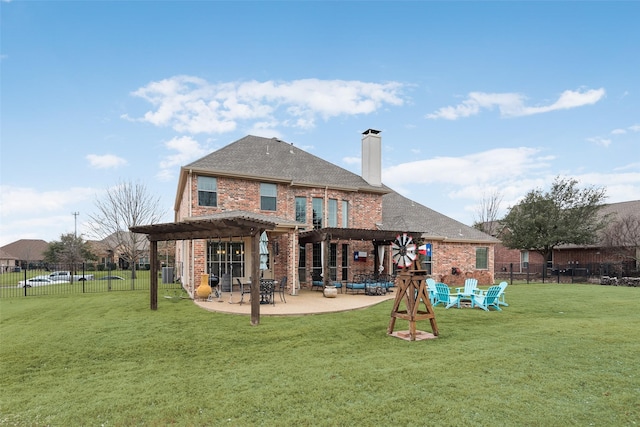 back of house with a patio, brick siding, fence, and a pergola