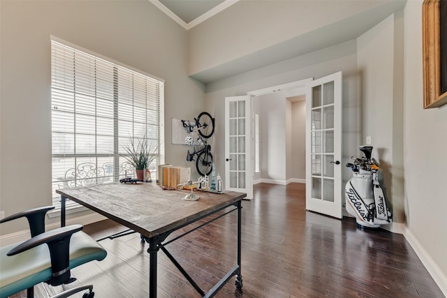 office with french doors, crown molding, a high ceiling, wood finished floors, and baseboards