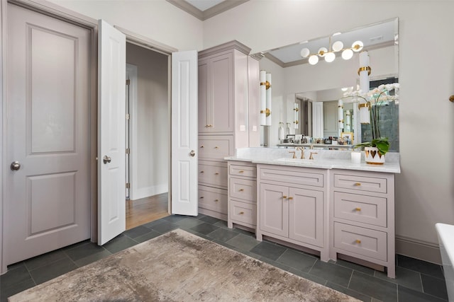 full bathroom featuring ornamental molding, vanity, and baseboards