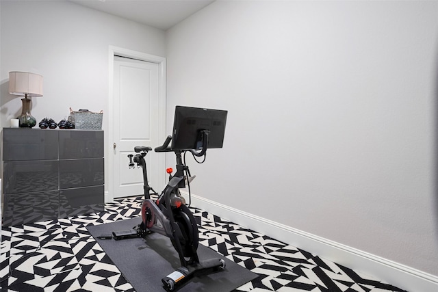 exercise room with baseboards