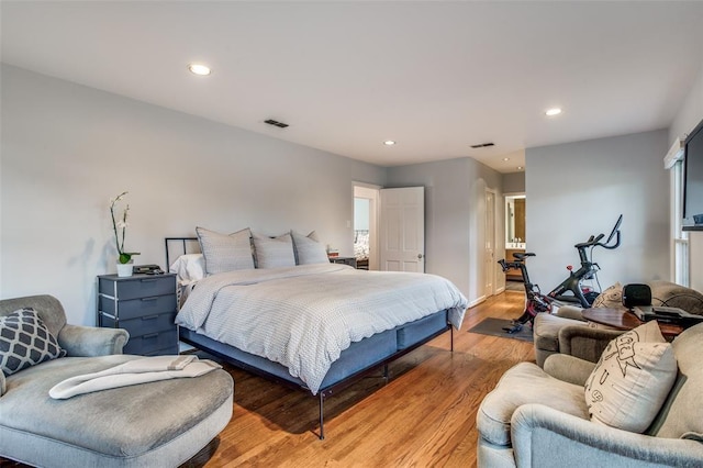 bedroom with recessed lighting, visible vents, and light wood finished floors