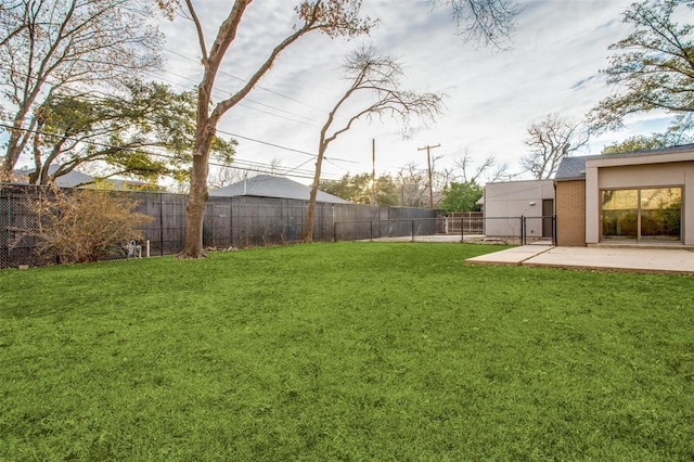 view of yard with a fenced backyard and a patio