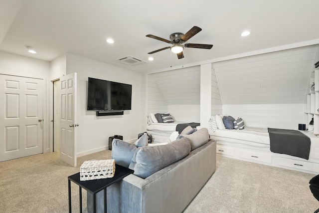 living area featuring light carpet, a ceiling fan, visible vents, and recessed lighting