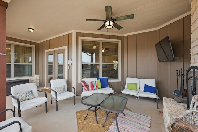 view of patio with an outdoor living space, a ceiling fan, and french doors