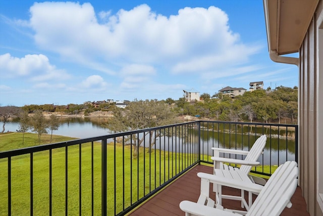 balcony featuring a water view