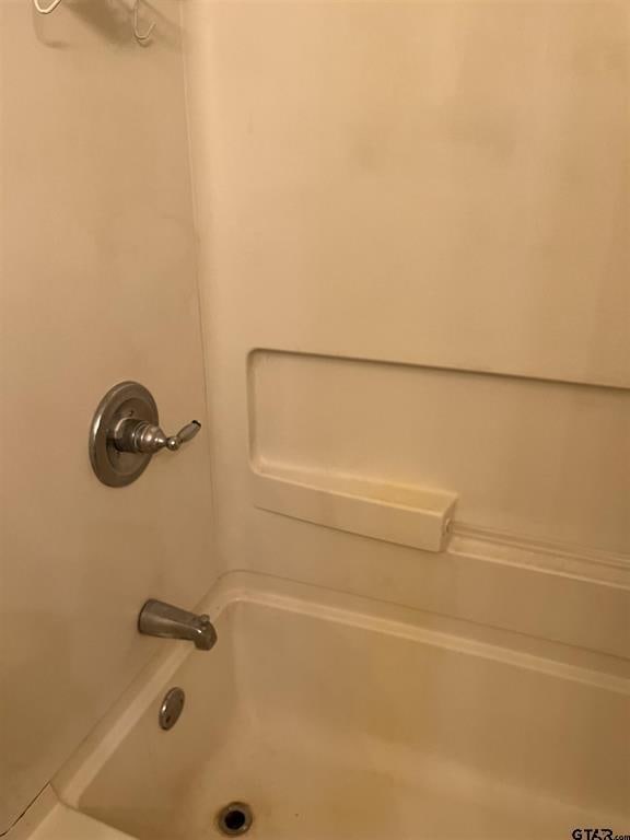 full bathroom with shower / bath combination