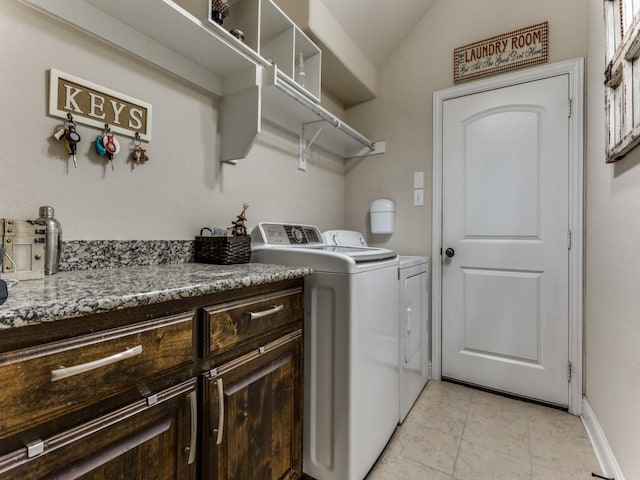 washroom with laundry area, light tile patterned floors, and washing machine and clothes dryer