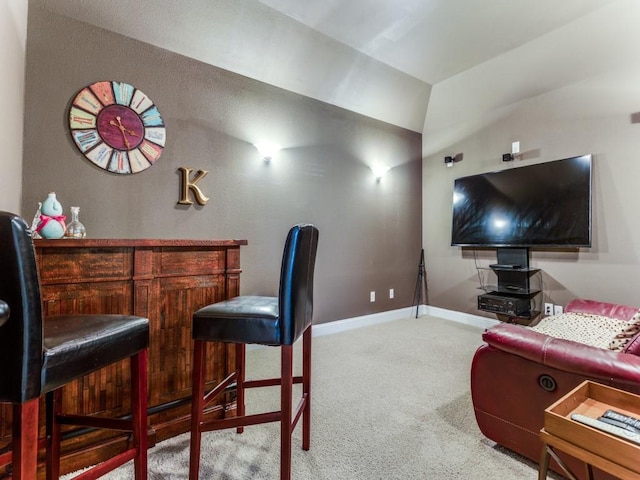 interior space featuring a bar and baseboards