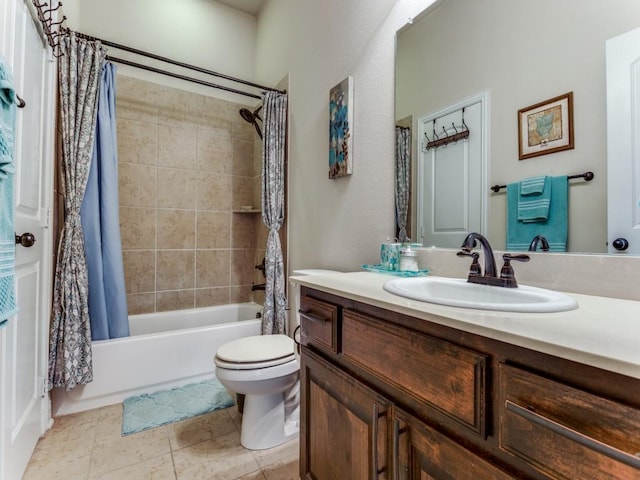 bathroom with toilet, tile patterned flooring, shower / bath combo with shower curtain, and vanity