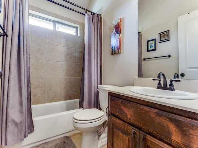 bathroom featuring vanity, toilet, and shower / tub combo with curtain