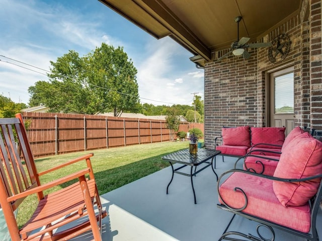 view of patio with ceiling fan, a fenced backyard, and an outdoor living space