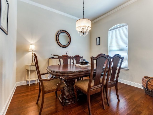 dining space featuring crown molding, dark wood finished floors, and baseboards