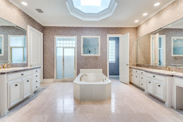 bathroom featuring a healthy amount of sunlight, visible vents, a sink, and wallpapered walls