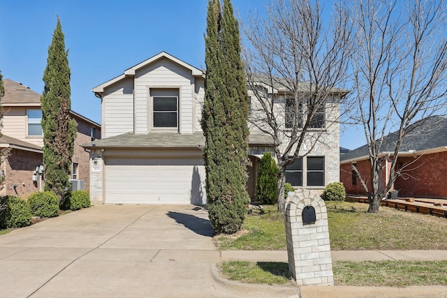 view of front of house featuring brick siding, driveway, central AC, and an attached garage