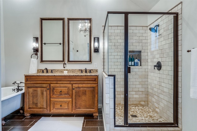 bathroom with double vanity, a stall shower, a soaking tub, and a sink