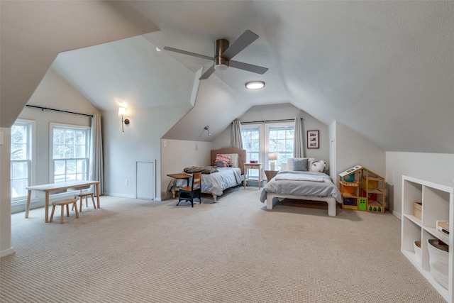 bedroom with carpet, ceiling fan, lofted ceiling, and baseboards