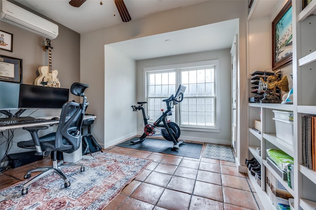 office area featuring ceiling fan, a wall mounted AC, and baseboards