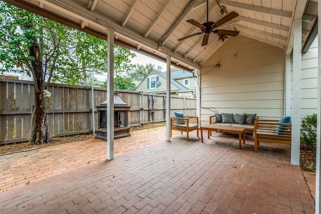 view of patio / terrace with ceiling fan, a fenced backyard, and an outdoor living space