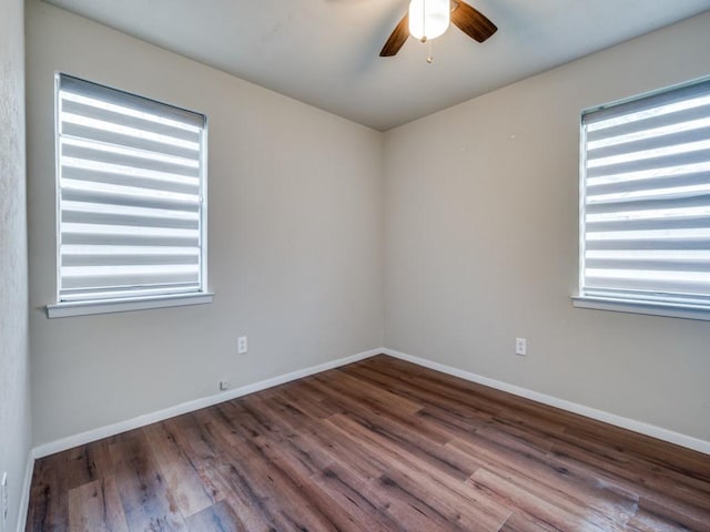 unfurnished room with ceiling fan, baseboards, and wood finished floors