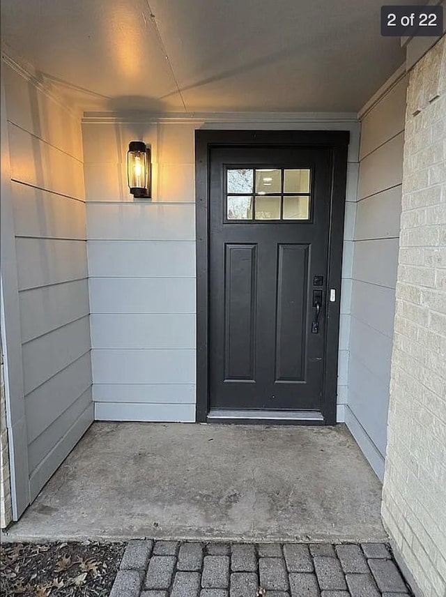 doorway to property with concrete block siding