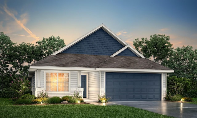 ranch-style house featuring a garage, concrete driveway, a shingled roof, and a yard