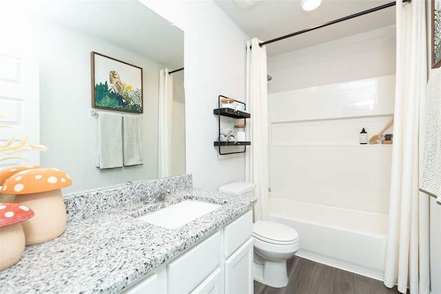 full bathroom featuring shower / bath combo with shower curtain, vanity, toilet, and wood finished floors