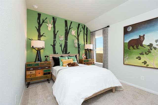 carpeted bedroom featuring baseboards and vaulted ceiling