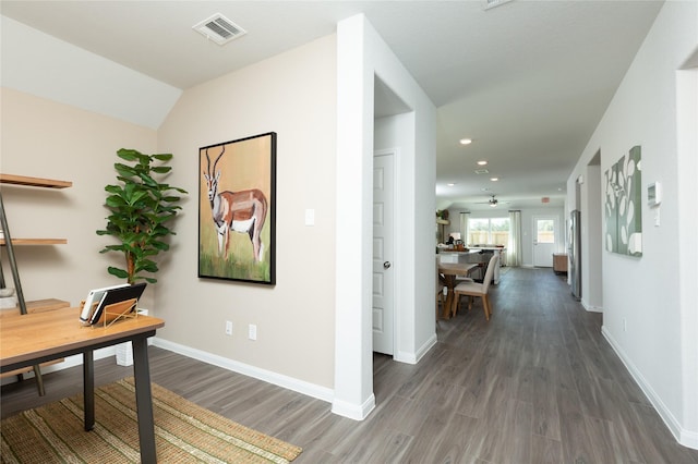 office with baseboards, visible vents, and wood finished floors