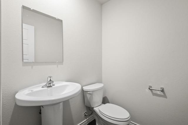 2400 Dahlia Dr, Fort Worth, TX 76123 - half bath with toilet and baseboards