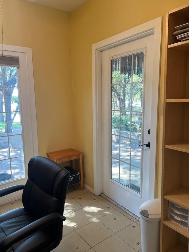 doorway featuring light tile patterned floors