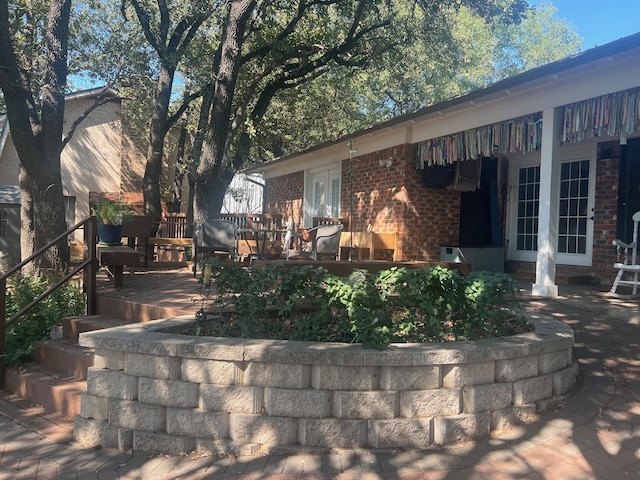 exterior space featuring brick siding