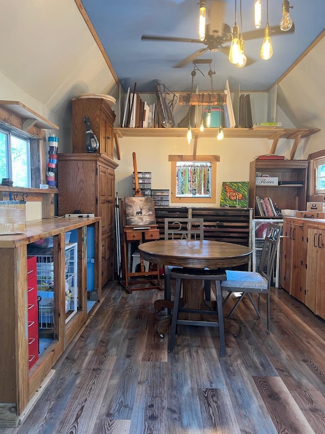 dining area featuring lofted ceiling, a ceiling fan, and wood finished floors