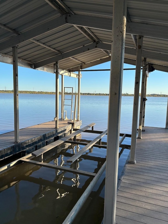 view of dock with a water view and boat lift