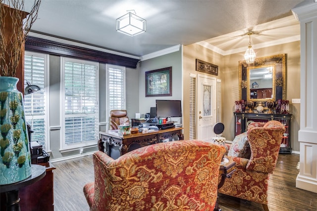 office area with ornate columns, baseboards, ornamental molding, and wood finished floors