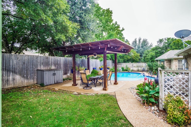 view of pool featuring a fenced in pool, a lawn, a fenced backyard, a patio area, and a pergola