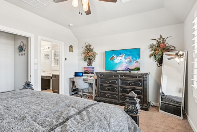 carpeted bedroom featuring visible vents, ensuite bathroom, ceiling fan, vaulted ceiling, and baseboards