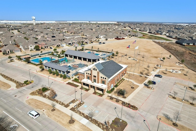 birds eye view of property with a residential view