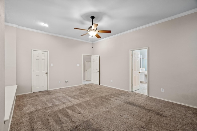 unfurnished bedroom featuring carpet, crown molding, connected bathroom, ceiling fan, and baseboards